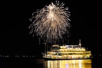 The paddle steamer <i>Michigan</i> cruises into port during the Otsu summer firework festival. Shiga Prefecture is a popular tourist destination, with over 52 million people visiting tourist sites in the prefecture during 2017. <br>(1 August 2014)