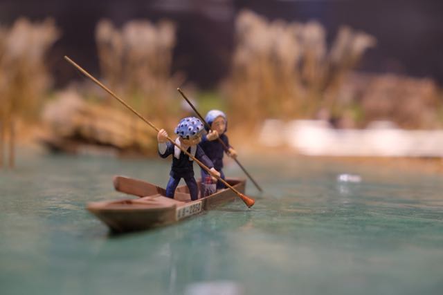 Diorama of people using the lakeside.