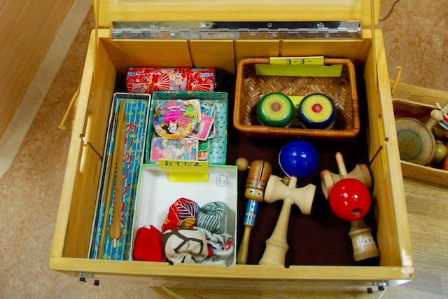 A discovery box full of traditional toys