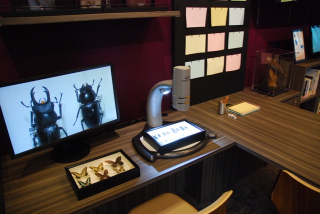 Microscope and monitor for examination of insect specimens.