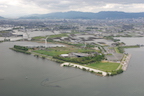 The Karasuma Peninsula, the Lake Biwa Museum (center) and the Mizu no Mori aquatic botanical gardens (next to the wind turbine). The peninsula is partly reclaimed land. (12 May 2010)