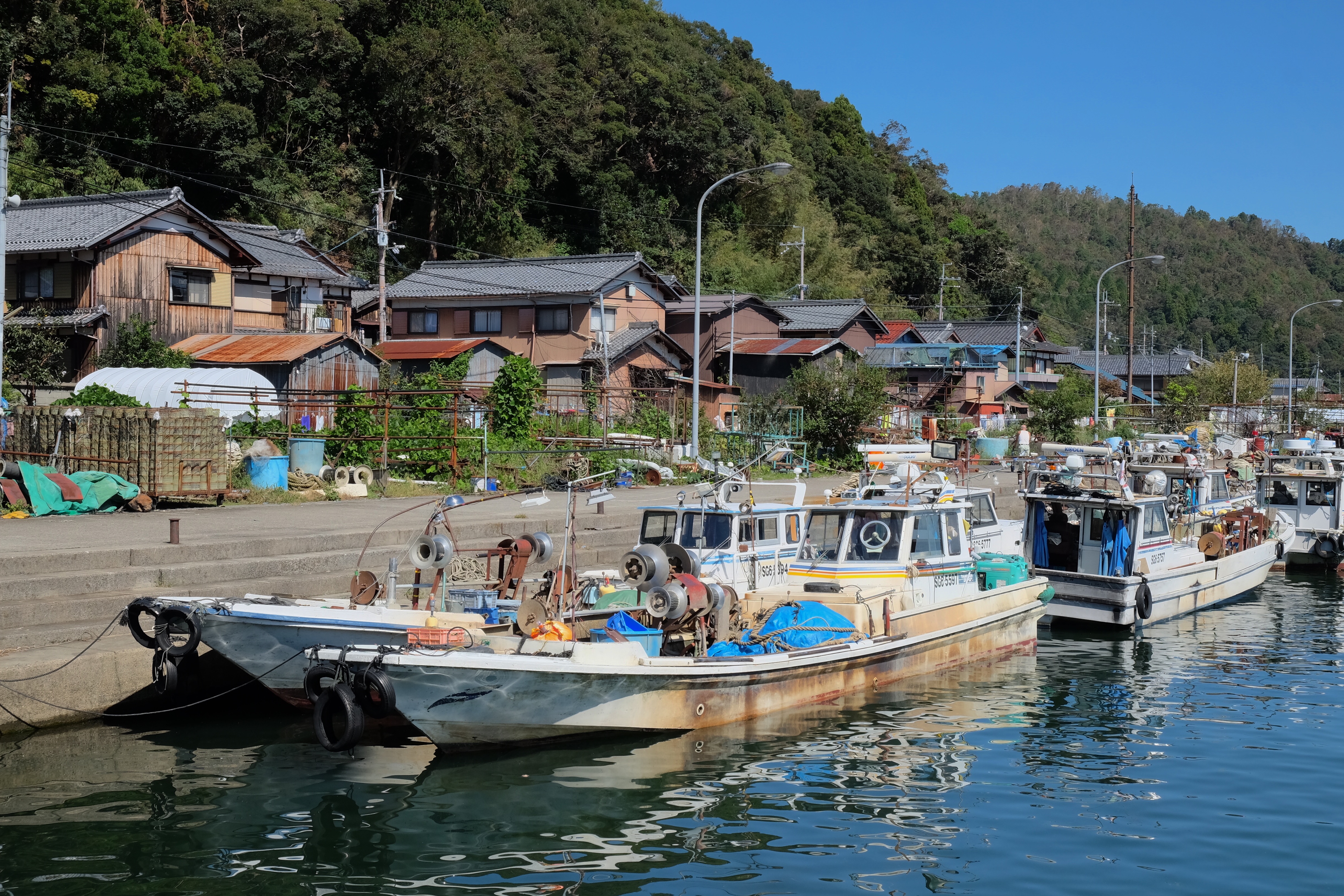 Fishing boats in the habour of Okishima. Most residents make a living by fishing, but tourists also bring revenue to the island. (8 October 2018)